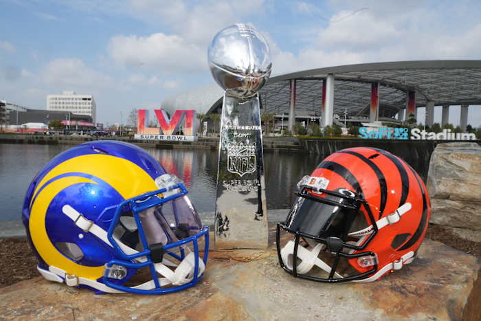 Los Angeles Rams and Cincinnati Bengals helmets are seen with a Vince Lombardi trophy at SoFi Stadium. The Rams and Bengals will play in Super Bowl LVI on Feb. 13, 202.